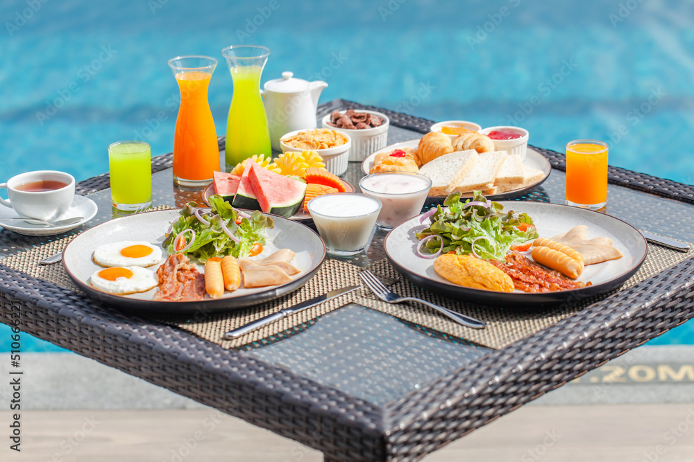 Delicious breakfast in luxury hotel. Vacation in resort by the water in ...