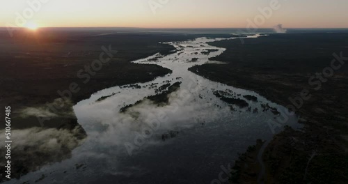 High aerial sunrise view of the mighty Zambezi River flowing down to the Victoria Falls, Unesco world heritage site