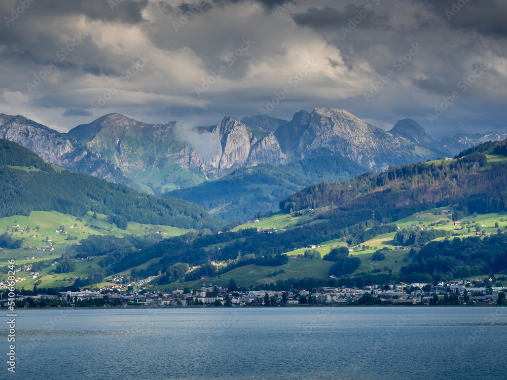 Cloudy view of the city of Lachen and the alps from the Upper Zurich Lake (Obersee), Schwyz, Switzerland