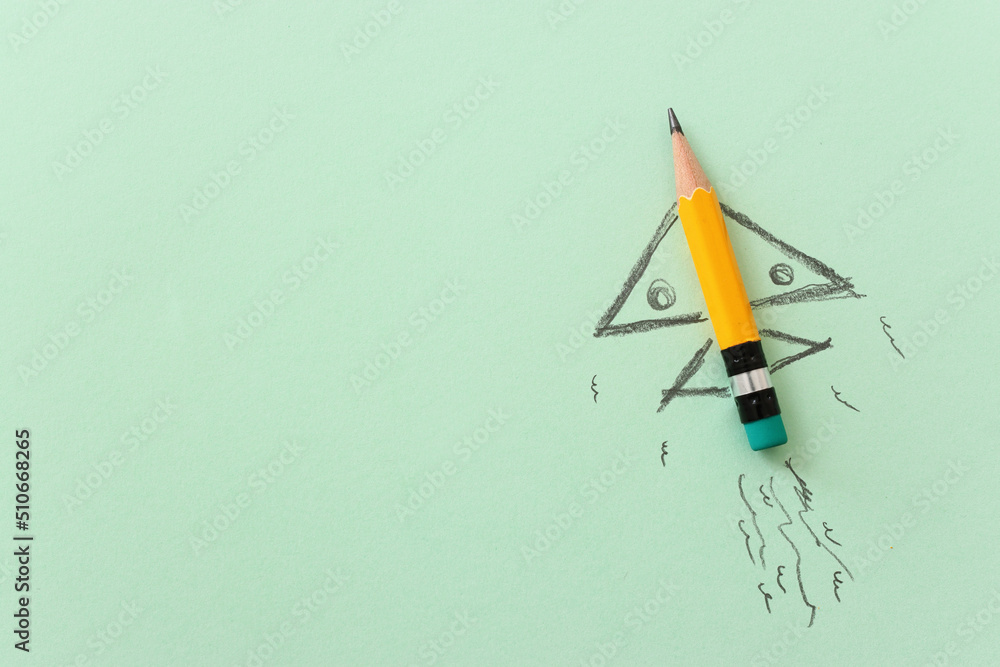 Pencil and rocket sketch over textured paper, concept of back to school, creativity and success Pencil and rocket sketch over textured paper, concept of back to school, creativity and success