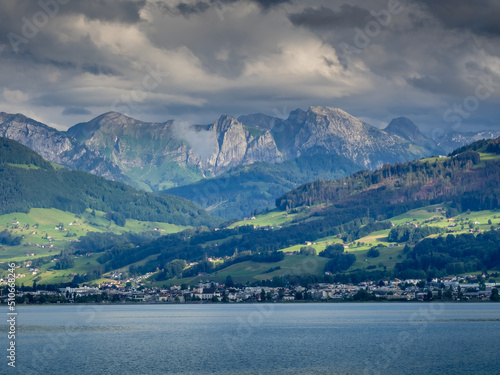 Fototapeta Naklejka Na Ścianę i Meble -  Cloudy view of the city of Lachen and the alps from the Upper Zurich Lake (Obersee), Schwyz, Switzerland