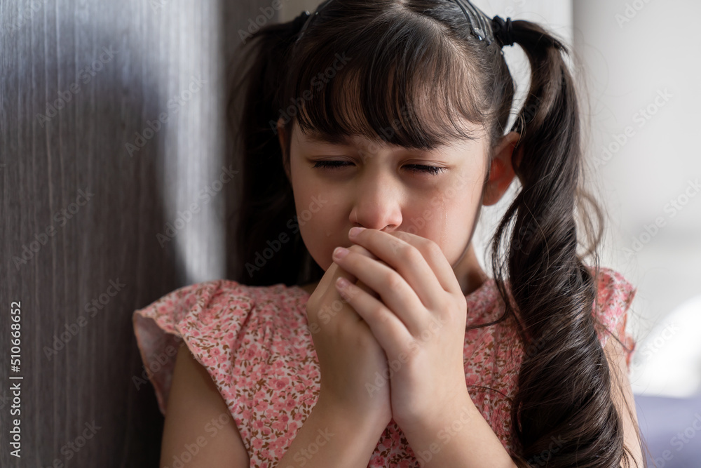 Close up of child girl crying with wet eyes from tears feels depressed and lonely. Little girl kid worried about parents arguing or problem at school. family negative, quarrels concept. Close up of child girl crying with wet eyes from tears feels depressed and lonely. Little girl kid worried about parents arguing or problem at school. family negative, quarrels concept.