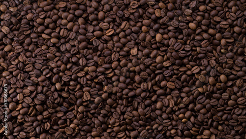 Roasted coffee beans background. Top view of panoramic coffee beans.