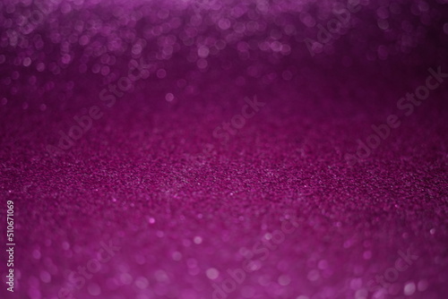 Defocused shiny purple background with round bubbles