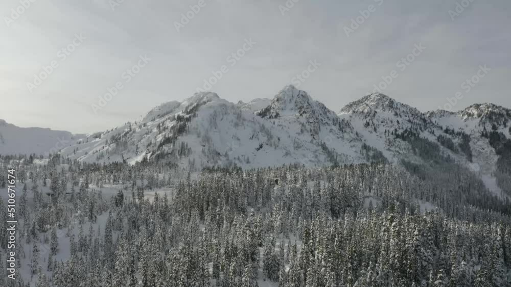 Flying over a winter wonderland with Mount Baker in the Cascade Mountains of Washington State. Flying over a winter wonderland with Mount Baker in the Cascade Mountains of Washington State.