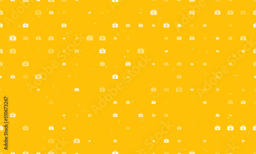 Seamless background pattern of evenly spaced white first aid symbols of different sizes and opacity. Vector illustration on amber background with stars