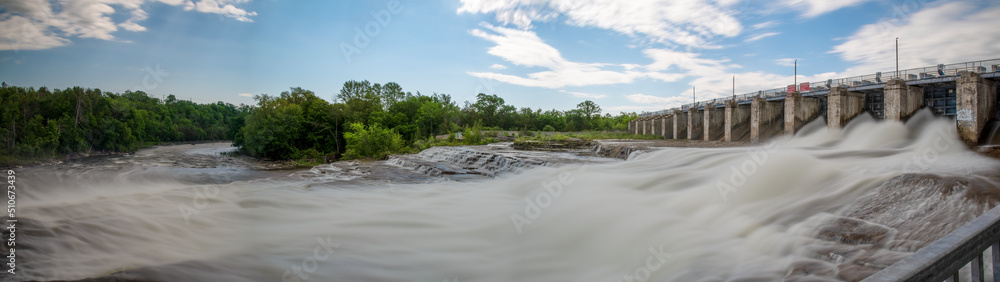 The rushing water of High Falls near Bancroft, Ontario gushes through the dam and down to Horseshoe Bay and out to the York River. The rushing water of High Falls near Bancroft, Ontario gushes through the dam and down to Horseshoe Bay and out to the York River.