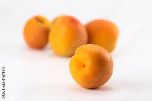 Fresh apricots on bright background. Selective focus.