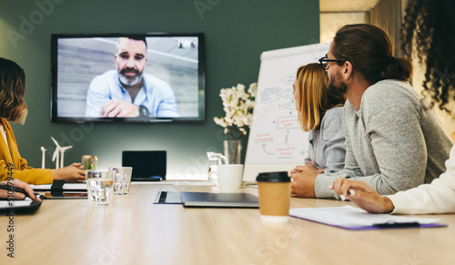 Creative businesspeople having a video conference in an office photo