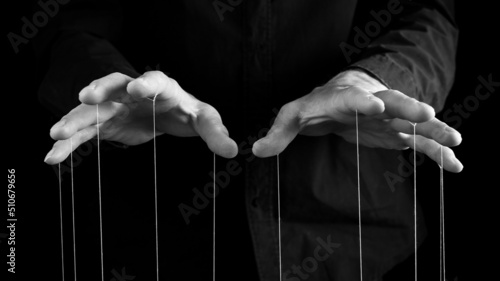 Man hands with strings on fingers. Violence, harassment, bullying concept. Master, abuser using influence to control person behavior. High quality photo photo