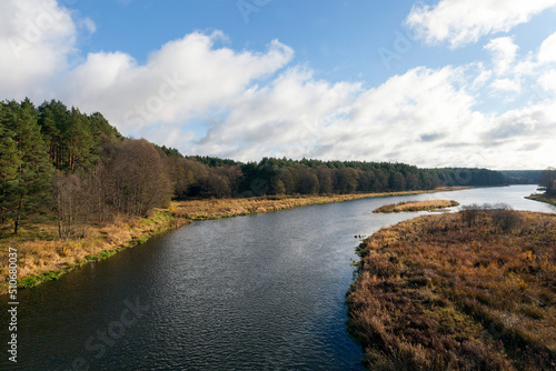 a wide river in the autumn season