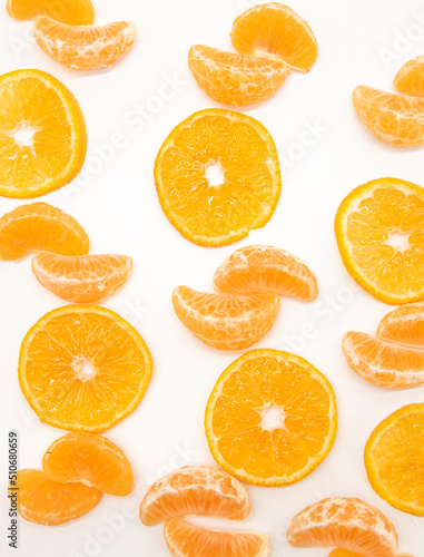 slice Tangerine or orange with leaf design isolated on white background,top view