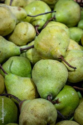 An abundance of pears for sale on a market stall