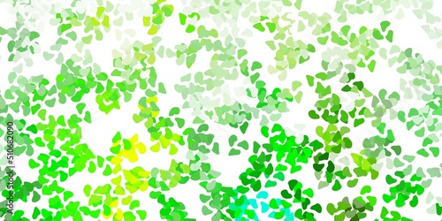 Light green  yellow vector backdrop with chaotic shapes.