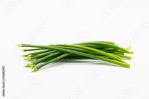 chives or garlic chives isolated on white .