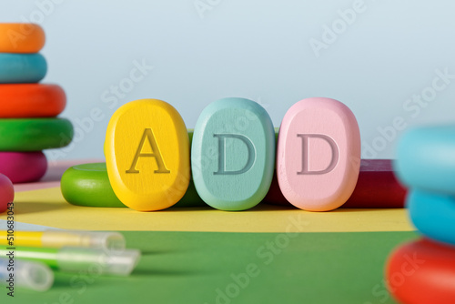 Colorful wooden block with ADD letters. Attention deficit disorder concept. photo