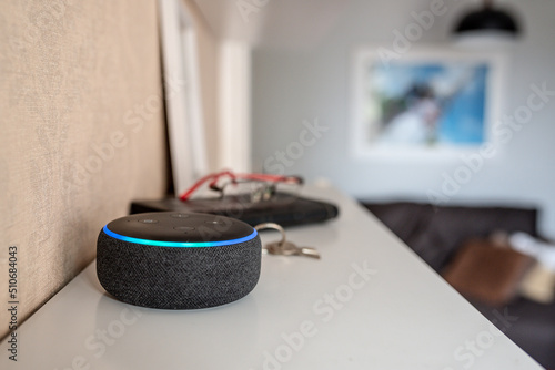 Rio de Janeiro, Brazil - January 28 2021: Amazon Echo Dot smart speaker with integrated Alexa voice assistant, home office. photo