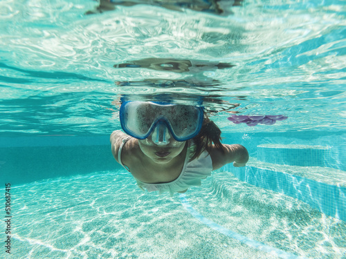 Little Girl Swim Underwater In Pool