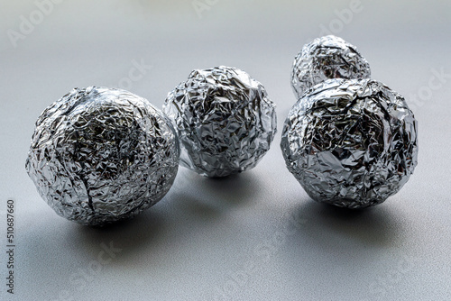 a few crumpled round foil balls
