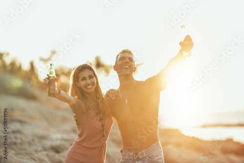 Couple Enjoying Sunset At The Beach