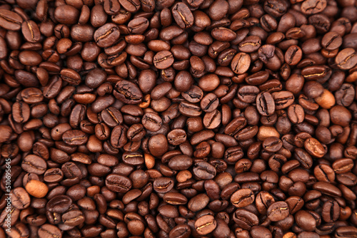 Close-up of roasted brown coffee beans background 