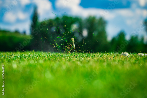 Fototapeta Naklejka Na Ścianę i Meble -  Playing golf. Golf course. Golf tee after shot.