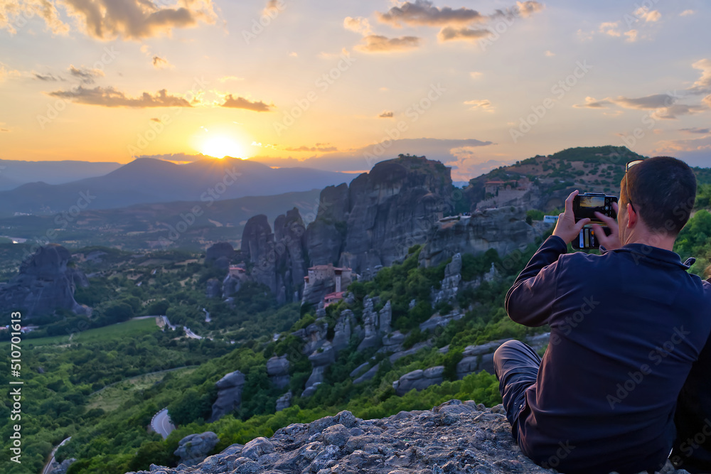Man on the Top of Mountain at Sunset. Greece, Meteora. close up