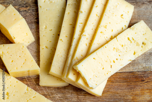 fresh yellow milk cheese on a board