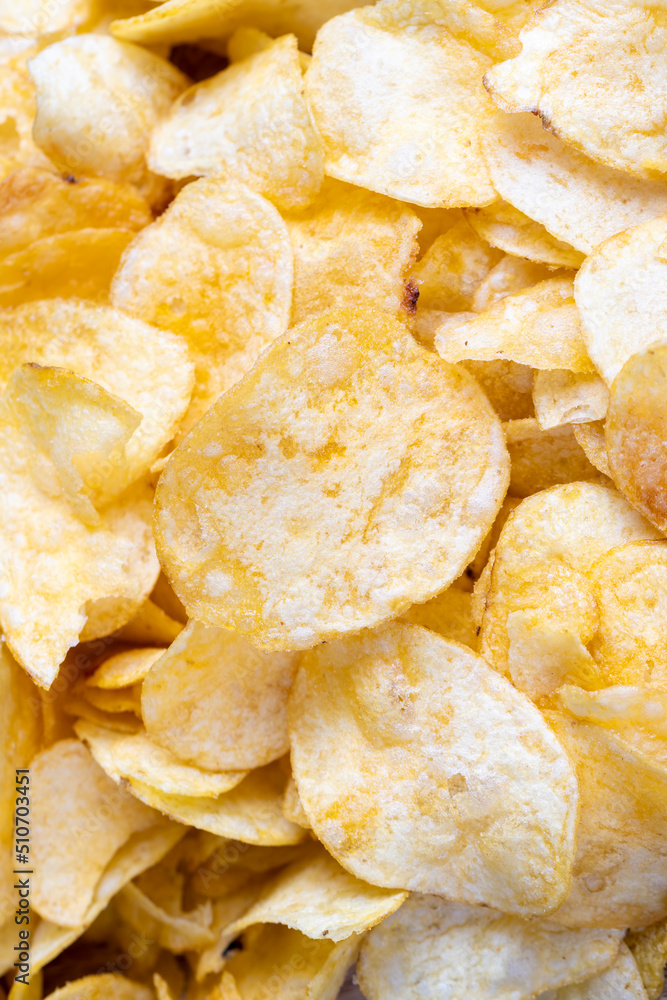 scattered potato chips with natural spices