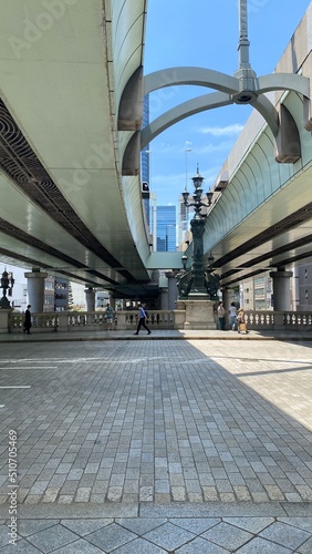 The curves and arcs of highway overhead the Nihonbashi bridge and the lamp post creates an interesting landscape. Street of Tokyo Japan, year 2022 June 13th