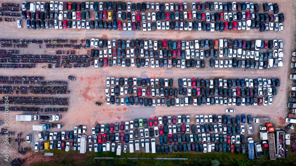 Yard of abandoned cars and seized for irregularity by the police. With many cars and many motorcycles parked. Aerial view