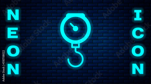 Glowing neon Hand scale spring mechanical icon isolated on brick wall background. Vector