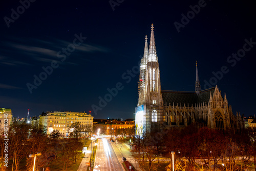 Capital of Austria Vienna at night  view on gothic church and streets of the city