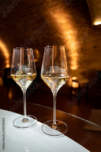 Photography Tasting of brut champagne sparkling wine produced by traditional method in under