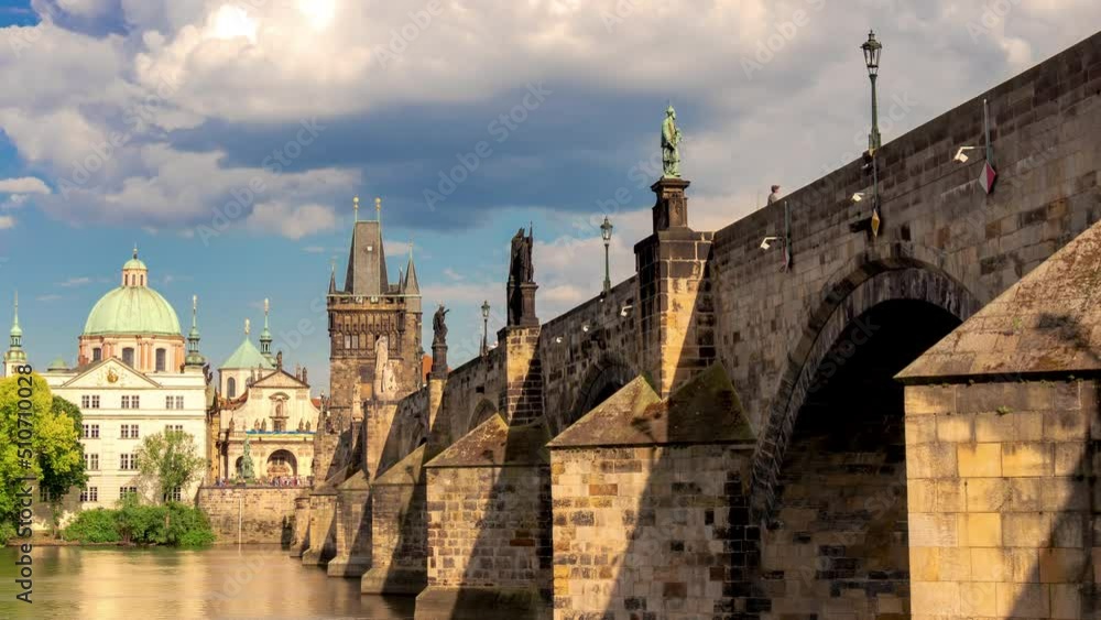Charles Bridge with Statues of Saints over the Vltava River in Prague During Summer Tourist Season, Visible Play of Light and Shadow