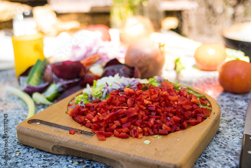 Farmer woman cooking outdoors in nature happily
