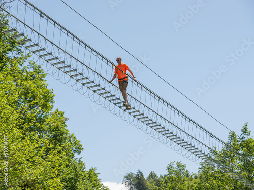  Iron sun bridge suspended in the void to cross the valley on foot photo