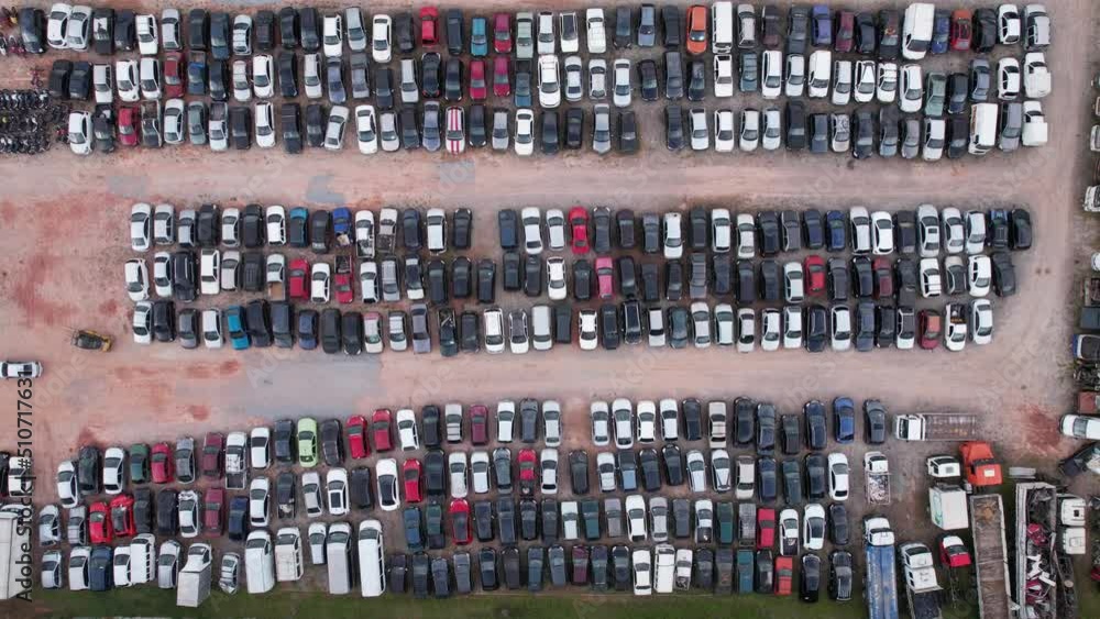 Yard of abandoned cars and seized for irregularity by the police. With many cars and many motorcycles parked. Aerial view Yard of abandoned cars and seized for irregularity by the police. With many cars and many motorcycles parked. Aerial view