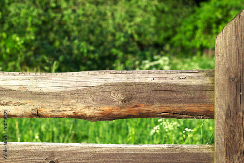 wooden fence with grass in summe countryside