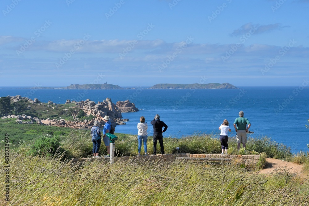Obraz premium People visiting the pink granite coast in brittany-France