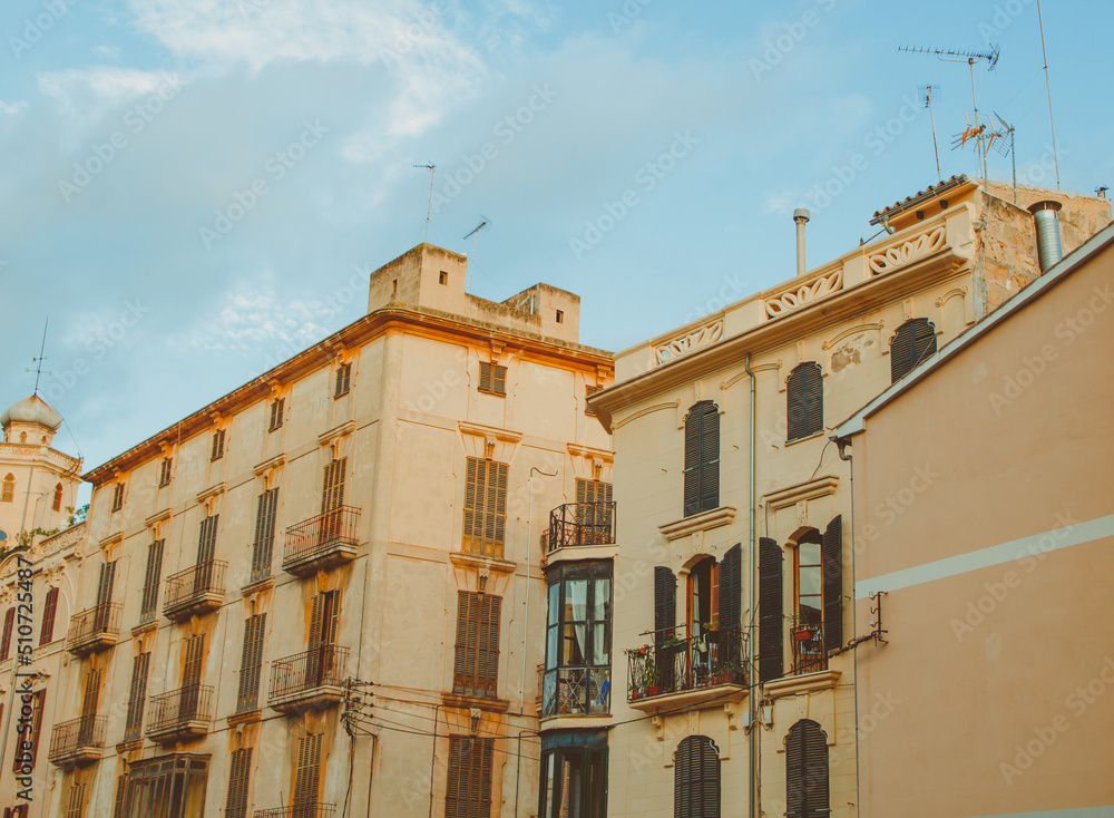 Old building facade, Palma de Mallorca, Spain. Old windows closeup of building in Spain. Facade of an ancient building
