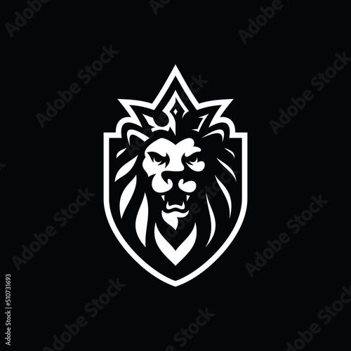 Lion king silhouette logo design. Lion head, shield and crown vector illustration on dark background