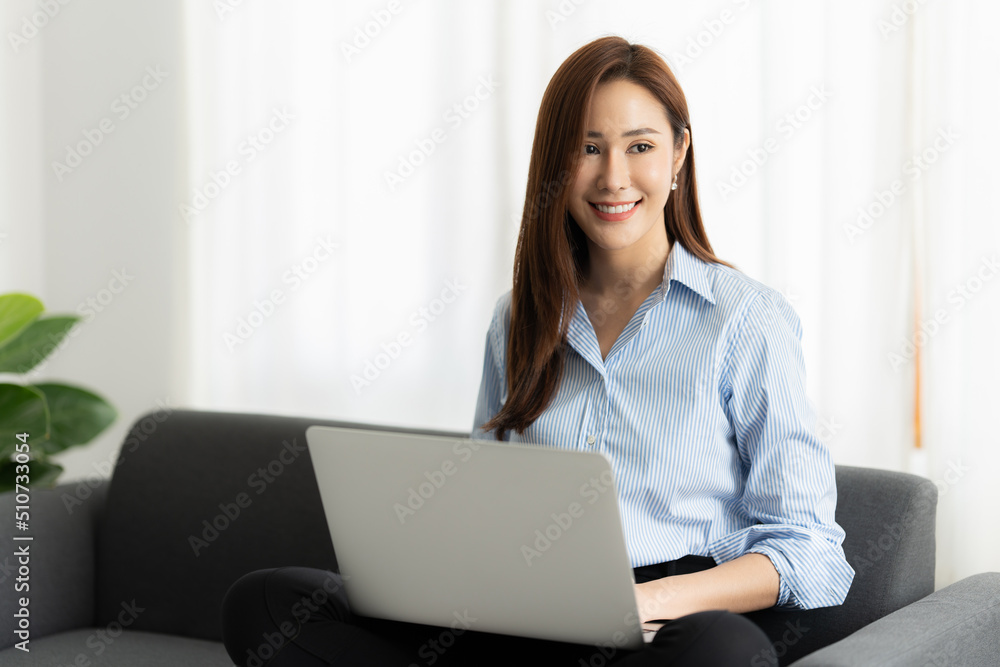 A portrait of Asian happy Businesswoman smiling and working at office. A portrait of Asian happy Businesswoman smiling and working at office.