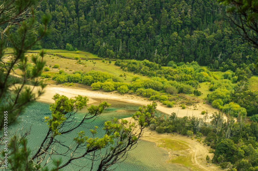 Upper course of a river from a lake with green and turquoise waters. Green Lake of the Calihuel River. Chubut, Argentina