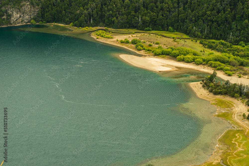 View from above of the upper course of a river from a lake with green and turquoise waters. Green Lake of the Calihuel River. Chubut, Argentina