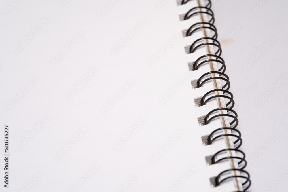 Business concept, black spiral notebook on white background Business concept, black spiral notebook on white background