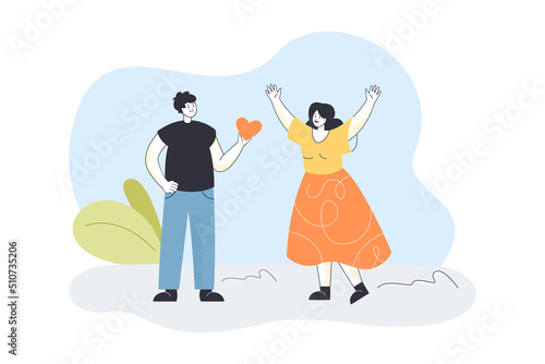 Man giving red heart to happy young woman on date. Male character holding romantic gift flat vector illustration. Valentines Day, love present concept for banner, website design or landing web page