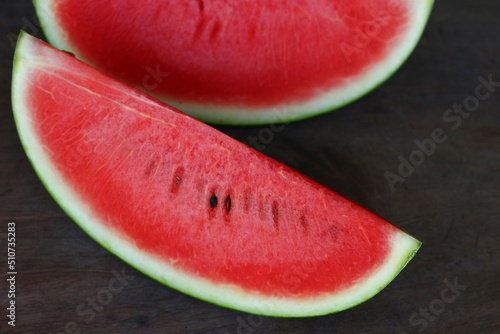 Watermelon slices are placed on the table, watermelon is a fruit that is sweet when we eat it makes us feel refreshed. Many people like to eat watermelon.