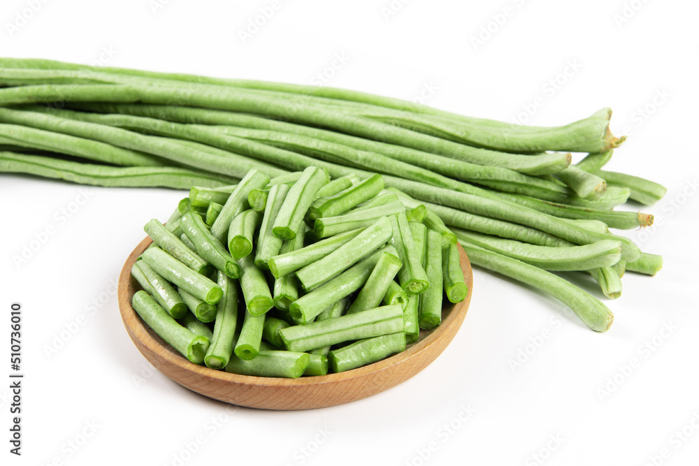 slice of long bean or cowpea in a plate on white background slice of long bean or cowpea in a plate on white background