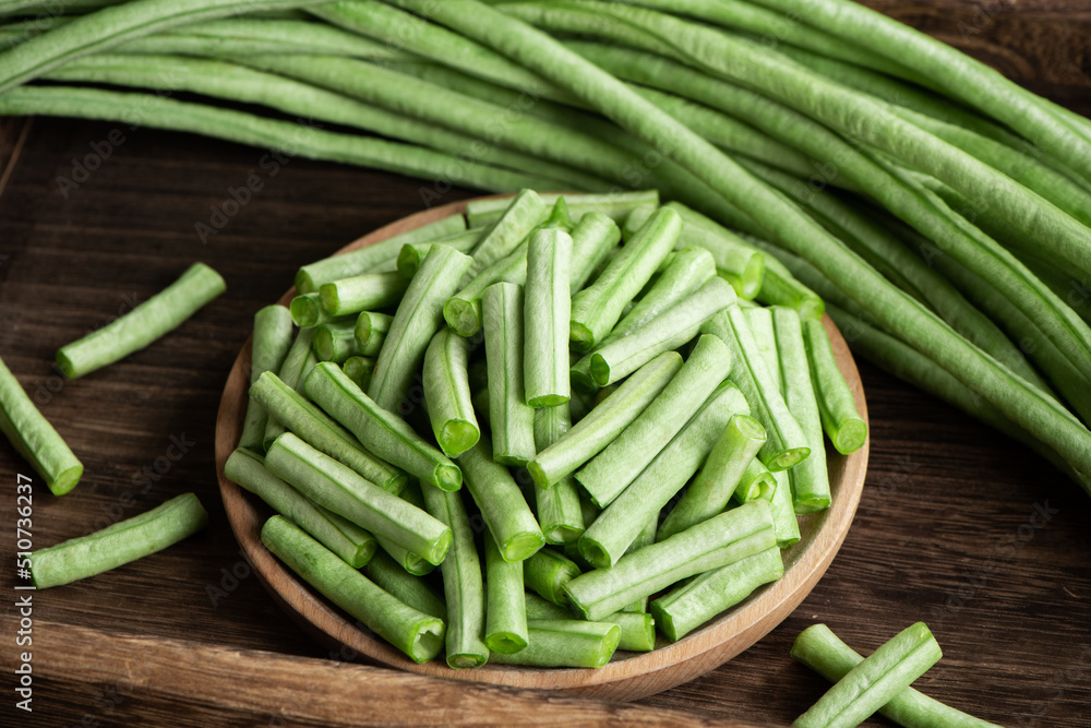slice of long bean or cowpea in a plate on table slice of long bean or cowpea in a plate on table